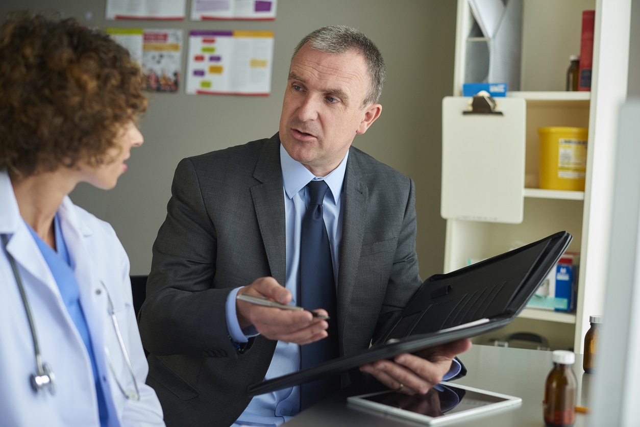 salesman chatting to a female doctor