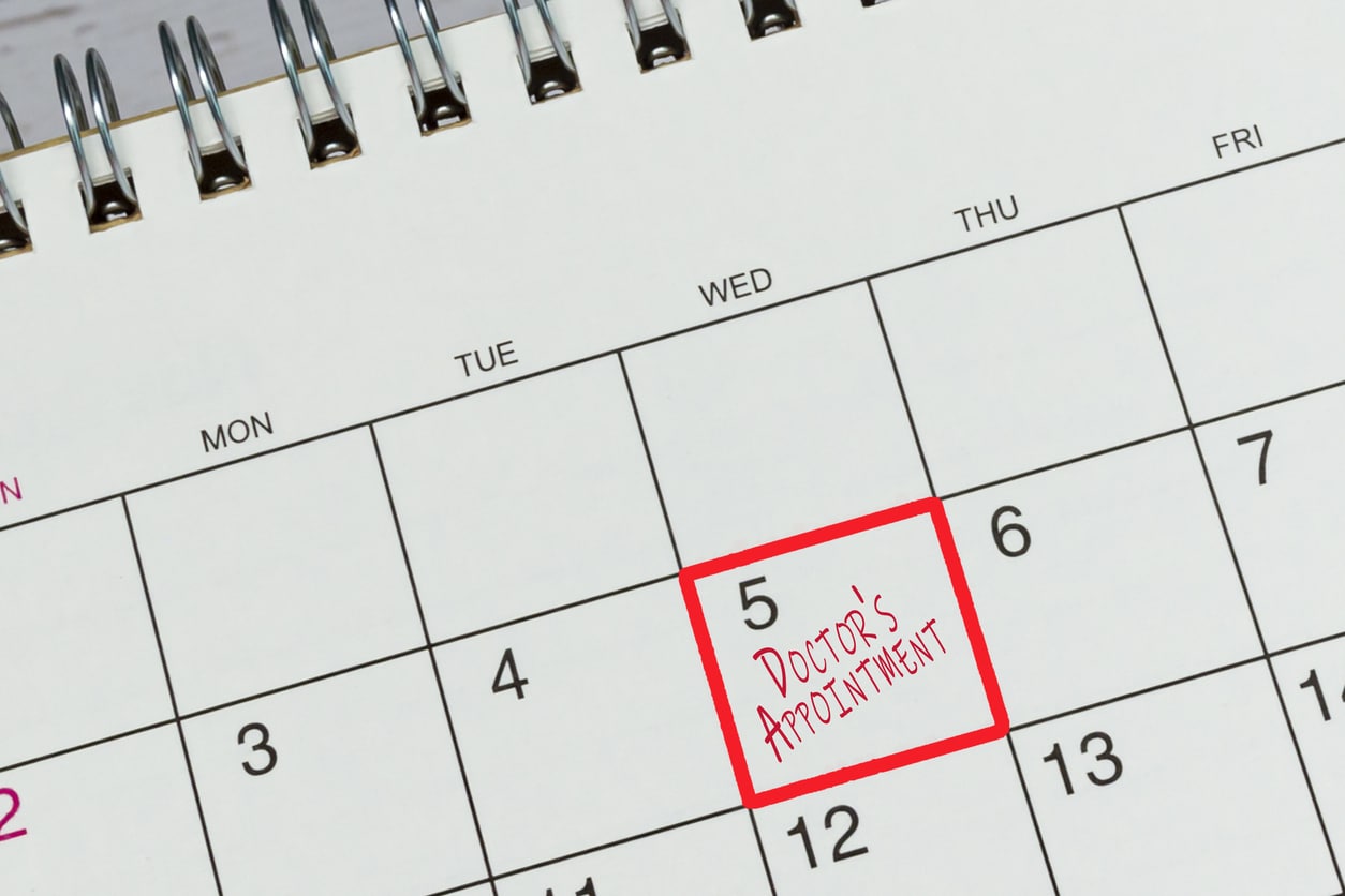 Red mark on the calendar at 5 for reminder of doctor's appointment.